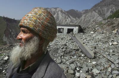 An earthquake survivor surveys the damage in Neelum valley in Pakistani Kashmir in March 2006. EPA