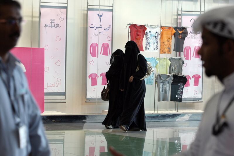 Saudi women walk at a shopping mall in the Saudi Arabian capital of Riyadh. Hassan Ammar / AFP Photo 