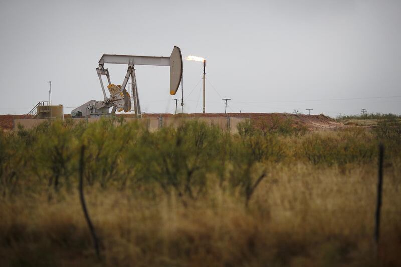 An electric oil pump jack stands in the oil fields surrounding Midland, Texas, U.S., on Wednesday, Nov. 8, 2017. Nationwide gross oil refinery inputs will rise above 17 million barrels a day before the year ends, according to Energy Aspects, even amid a busy maintenance season and interruptions at plants in the U.S. Gulf of Mexico that were clobbered by Hurricane Harvey in the third quarter. Photographer: Luke Sharrett/Bloomberg