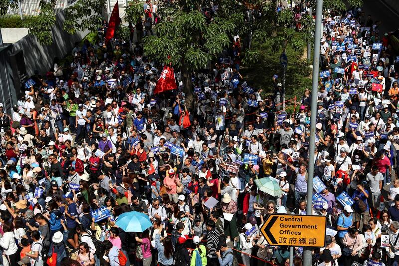 People gather during a pro-government rally to show their support for the police and government outside the Legislative Council (LegCo) building in Hong Kong, China. Reuters