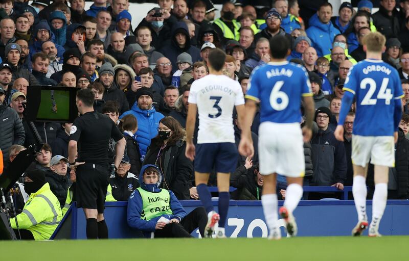 Referee Chris Kavanagh looks at the VAR monitor before ruling out a penalty decision. AFP