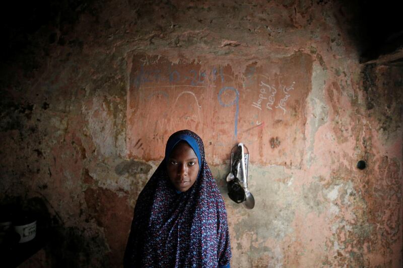 A Palestinian girl poses for a photo inside her family home in Jabalia refugee camp in the northern Gaza Strip. Reuters