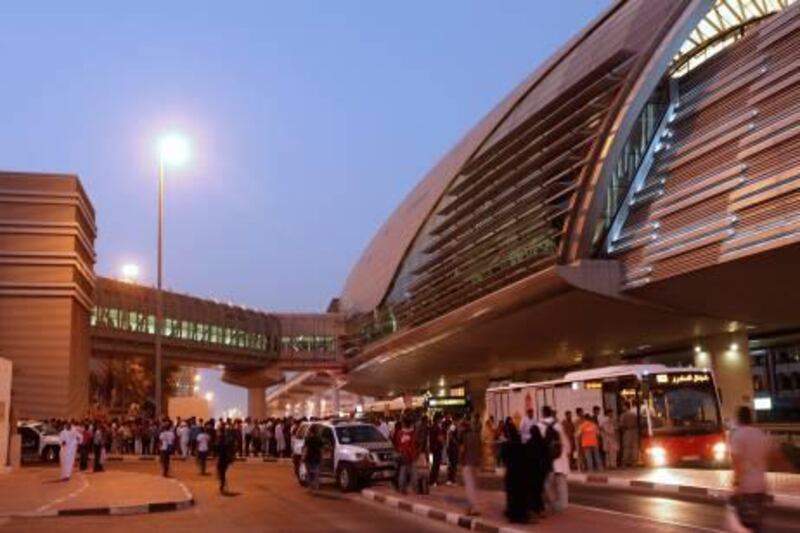 Dubai, 30th August 2011.  Stranded commuters queue for the Metro buses that will take them south.  (Jeffrey E Biteng / The National)  Editor's Note;  Martin C reports.