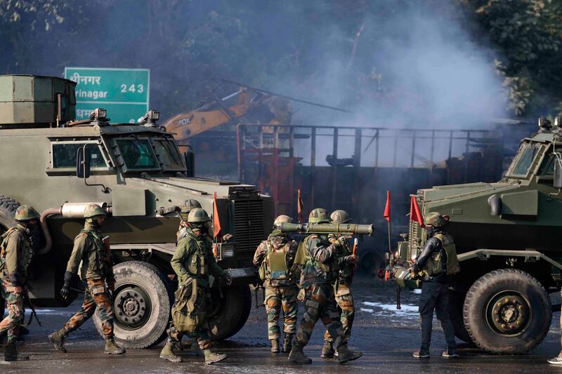 Indian soldiers at the site of the gun battle at Nagrota, on the Jammu-Srinagar motorway. AP