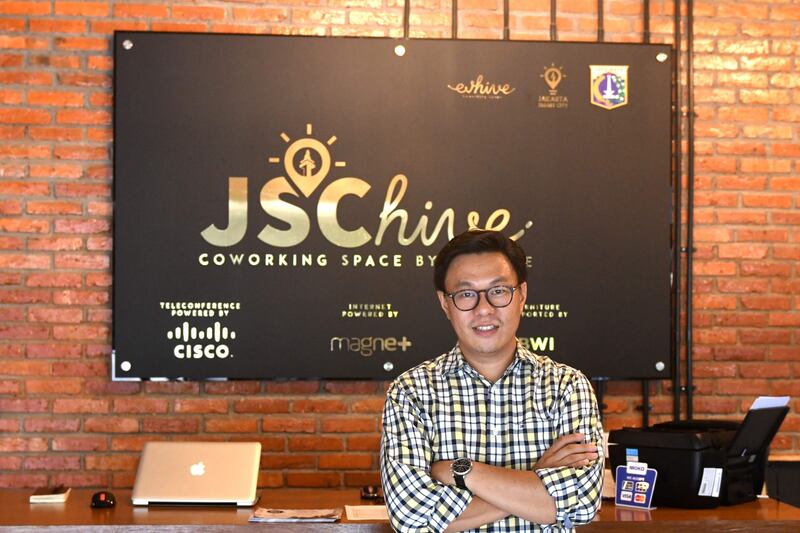 This picture taken on September 12, 2017 shows Willson Cuaca, one of the co-owners of the EV-Hive event space, a co-working space, in Jakarta.  
Big-name investors including Expedia and Alibaba are pumping billions of dollars into Indonesian tech start-ups in a bid to capitalise on the country���s burgeoning digital economy and potential as Southeast Asia���s largest online market. Indonesia has seen a surge of cash into its technology sector over the past two years, helping support dozens of homegrown start-ups ranging from ride hailing apps to e-commerce firms. / AFP PHOTO / GOH Chai Hin / TO GO WITH Indonesia-technology-startups, FOCUS by Harry PEARL