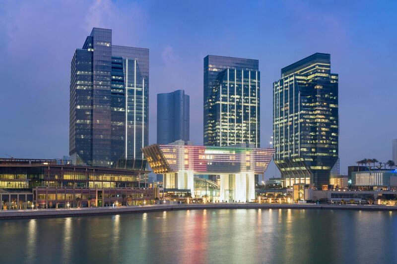 FH1NBM Evening view of new financial and business district called Abu Dhabi Global Market square (ABGM) on Al Maryah Island Abu Dhabi. Alamy