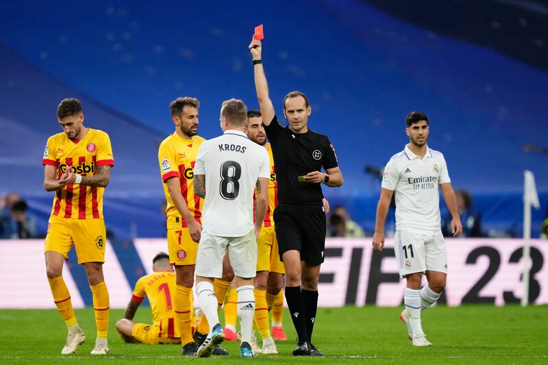 Real Madrid's Toni Kroos is shown a red card for a second bookable offence. AP Photo