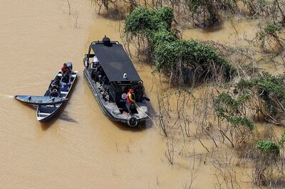 Police officers and rescue team conduct a search operation for Dom Phillips and indigenous expert Bruno Pereira. Reuters