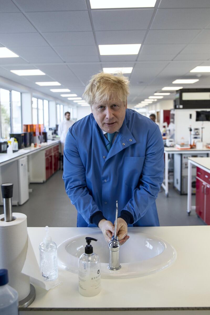 BEDFORD, ENGLAND - MARCH 06: Prime Minister Boris Johnson washes his hands during a visit to the Mologic Laboratory in the Bedford technology Park on March 06, 2020 in Bedford, England. The Prime Minister is announcing a Â£46 million funding package to help UK scientists develop testing kits and a vaccine in the fight against the Coronavirus. (Photo by Jack Hill - WPA Pool / Getty Images)