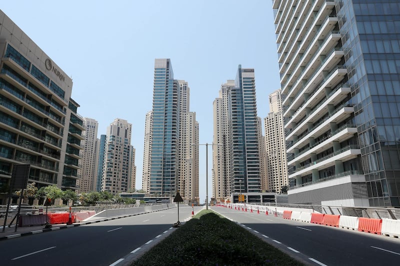 DUBAI, UNITED ARAB EMIRATES , April 17– 2020 :- View of the empty roads in Dubai Marina in Dubai. Dubai is conducting 24 hours sterilisation programme across all areas and communities in the Emirate and told residents to stay at home. UAE government told residents to wear face mask and gloves all the times outside the home whether they are showing symptoms of Covid-19 or not.  (Pawan Singh / The National) For News/Online/Instagram