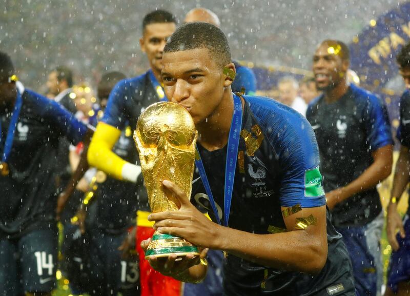 Soccer Football - World Cup - Final - France v Croatia - Luzhniki Stadium, Moscow, Russia - July 15, 2018  France's Kylian Mbappe celebrates with the trophy after winning the World Cup  REUTERS/Kai Pfaffenbach