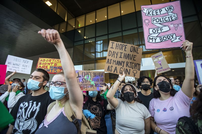 Demonstrators hold placards and shout slogans during an abortion rights protest in Los Angeles. Bloomberg