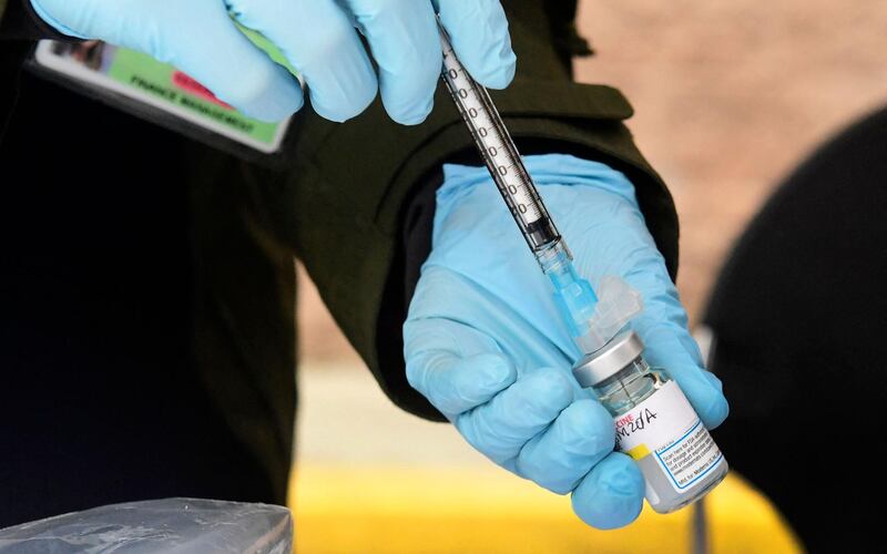 (FILES) In this file photo Registered Nurse Emily Enos loads the Moderna Covid-19 vaccine into a syringe ahead of the distribution of vaccines to seniors above the age of 65 who are experiencing homelessness at the Los Angeles Mission, in the Skid Row area of Downtown Los Angeles, California on February 10, 2021, as the fight against the coronavirus pandemic continues.   The United Nations on February 17, 2021 led calls for a coordinated global effort to vaccinate against Covid-19, warning that gaping inequities in initial efforts put the whole planet at risk.Foreign ministers met virtually for a first-ever UN Security Council session on vaccinations called by current chair Britain, which said the world had a "moral duty" to act together against the pandemic that has killed more than 2.4 million people.
 / AFP / Frederic J. BROWN
