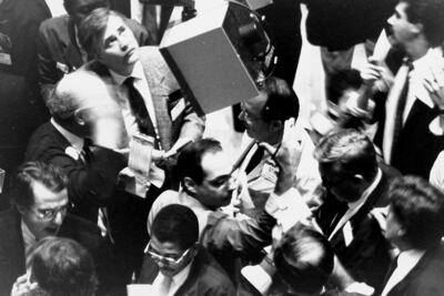 Traders crowd Stock Exchange floor. Black Monday at the American Stock Exchange, on October 19, 1987. Are there signals such a crash could be repeated soon? (Getty Images