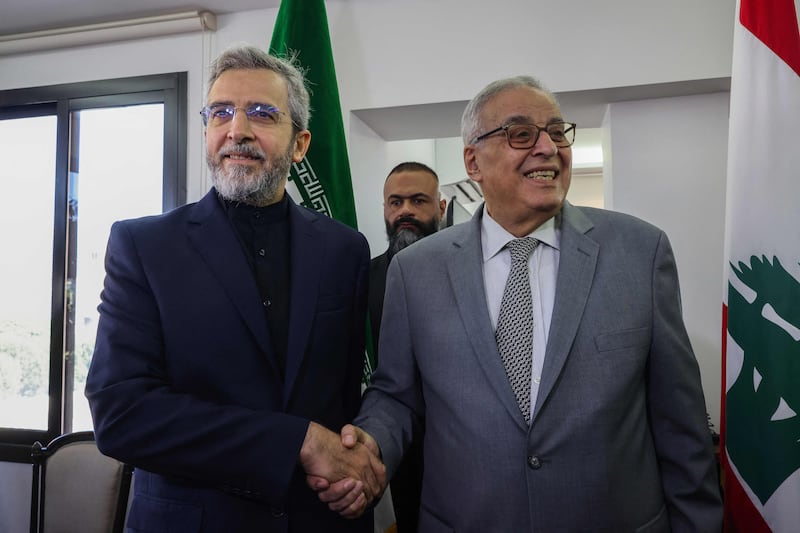 Lebanon's caretaker Foreign Minister Abdallah Bou Habib, right, with Iran's acting Foreign Minister Ali Bagheri Kani in Beirut on Monday. AFP