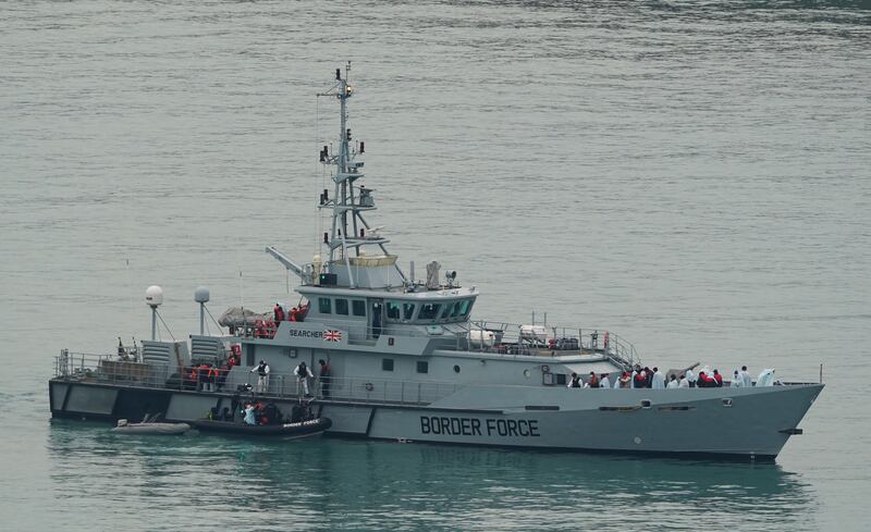 A Border Force vessel carries people thought to be migrants into Dover, Kent, following a small boat incident in the Channel. PA