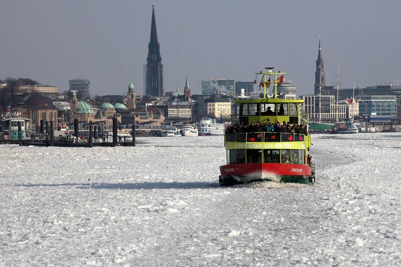 A ferry makes its way through ice sheets covering the water in Hamburg's port area on February 5, 2012. The deadly cold snap that has gripped Europe for more than a week strained emergency services, wrought travel chaos and claimed more lives on February 5, bringing to more than 300 the tally of victims.  AFP PHOTO / BODO MARKS    GERMANY OUT
 *** Local Caption ***  807478-01-08.jpg