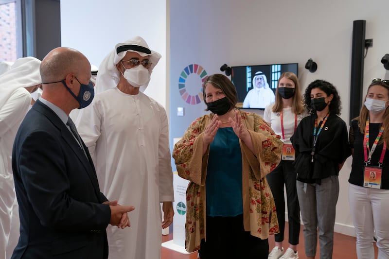 Sheikh Mohamed is briefed by UN officials during his visit.