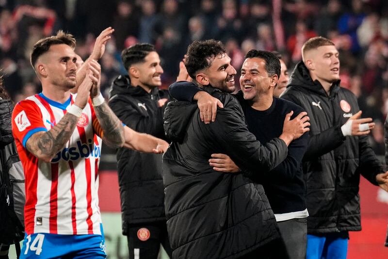 GironaÂ´s head coach Michel (2R) celebrates with his players after winning the Spanish LaLiga soccer match between Girona FC and Atletico Madrid, in Girona, Spain, 03 January 2024.   EPA / Siu Wu
