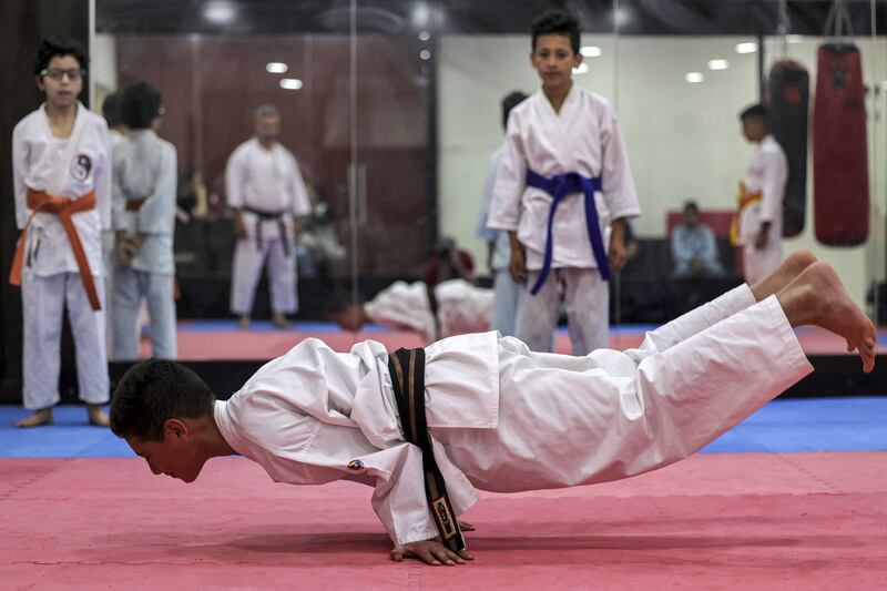 A Palestinian karate student balances on two hands at a dojo in the city of Ramallah in the occupied West Bank. All photos: AFP
