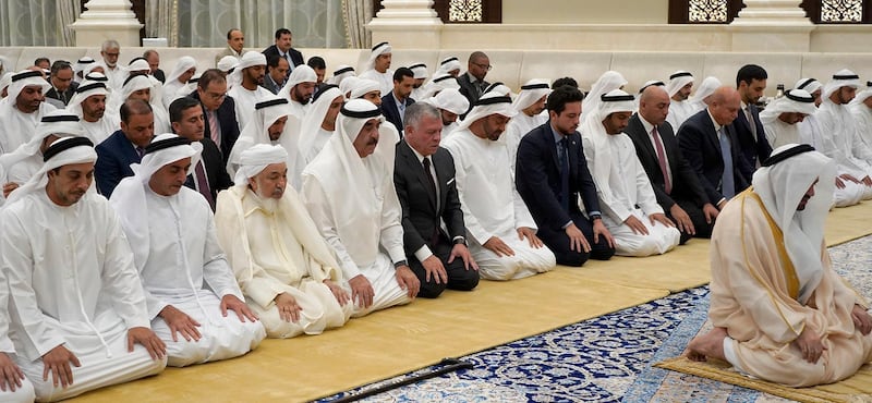 A handout picture released by the Jordanian Royal Palace on May 22, 2019 shows Jordanian King Abdullah II (5th-L) and his son Crown Prince Hussein (7th-L) performing prayers alongside the UAE's Sheikh Mohamed bin Zayed Al-Nahyan (6th-L), Crown Prince of Abu Dhabi Deputy Supreme Commander of the Armed Forces, in Abu Dhabi. (Photo by Yousef ALLAN / Jordanian Royal Palace / AFP) / RESTRICTED TO EDITORIAL USE - MANDATORY CREDIT "AFP PHOTO / JORDANIAN ROYAL PALACE / YOUSEF ALLAN" - NO MARKETING NO ADVERTISING CAMPAIGNS - DISTRIBUTED AS A SERVICE TO CLIENTS