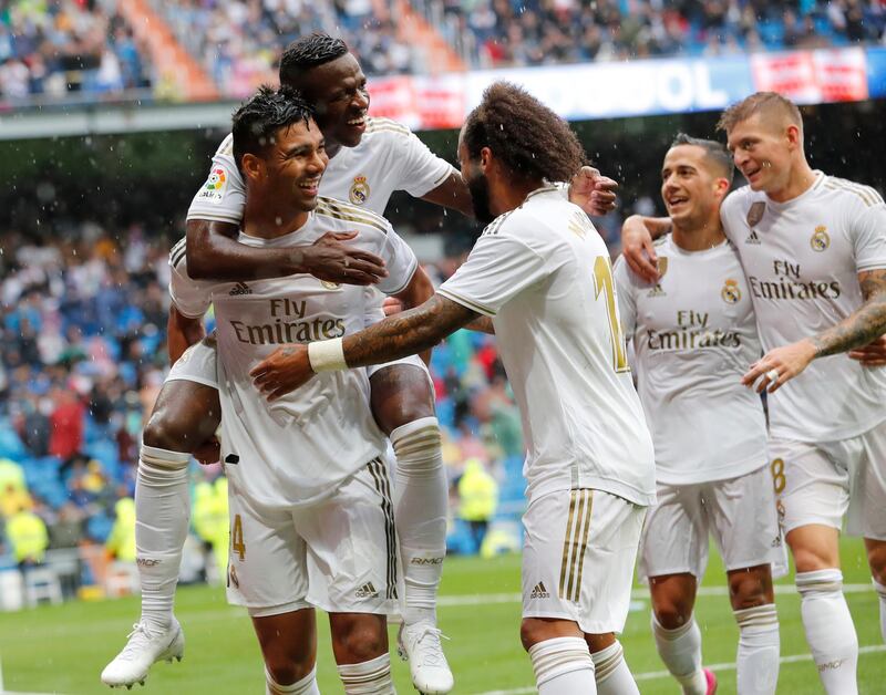 Real Madrid's Casemiro celebrates with teammates. AP Photo