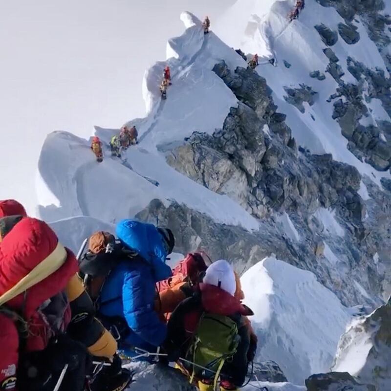 Climbers descend from the summit of Everest down the Hillary Step. At least 11 climbers have died so far this season. Reuters