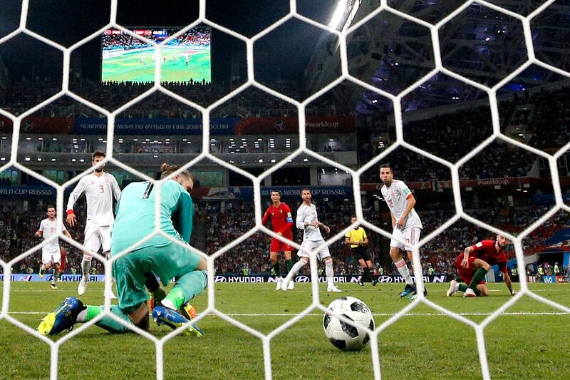 Spain's goalkeeper David de Gea looks back over his shoulder after letting a Cristiano Ronaldo shot rebound off of him and into the net, putting Portugal 2-1 up. Dean Mouhtaropoulos / Getty Images
