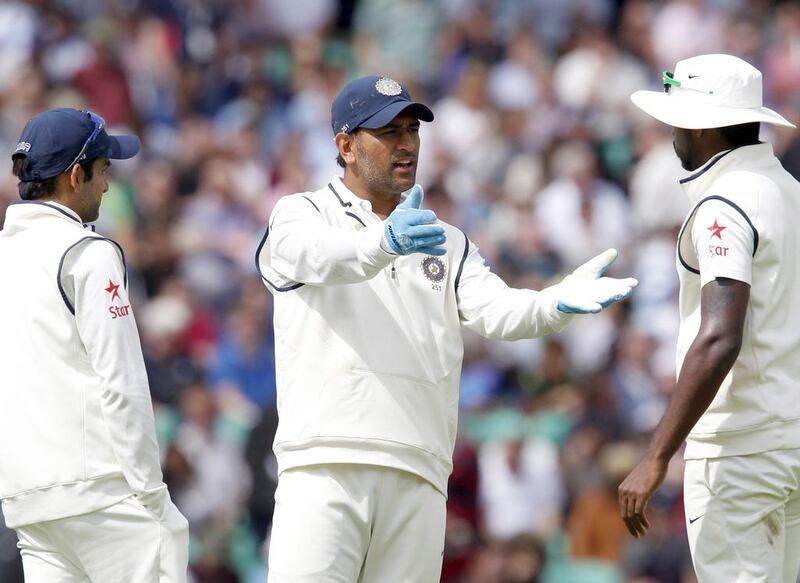 MS Dhoni, centre, called time on his Test career in December, shocking the cricket world. Ian Kington / AFP