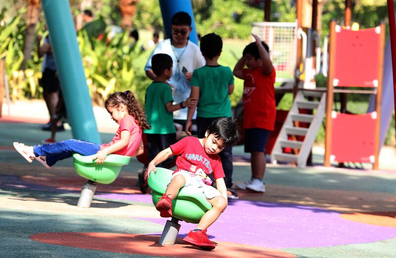 Young residents enjoy some fun in a play area at Zabeel Park on National Day. Pawan Singh / The National