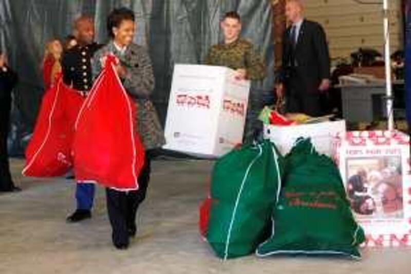 First lady Michelle Obama delivers Christmas toys from White House staff to the Toys For Tots Stafford County Distribution Center in Stafford, Va., Wednesday, Dec. 16, 2009. (AP Photo/Gerald Herbert) *** Local Caption ***  VAGH103_Michelle_Obama_Toys_For_Tots.jpg