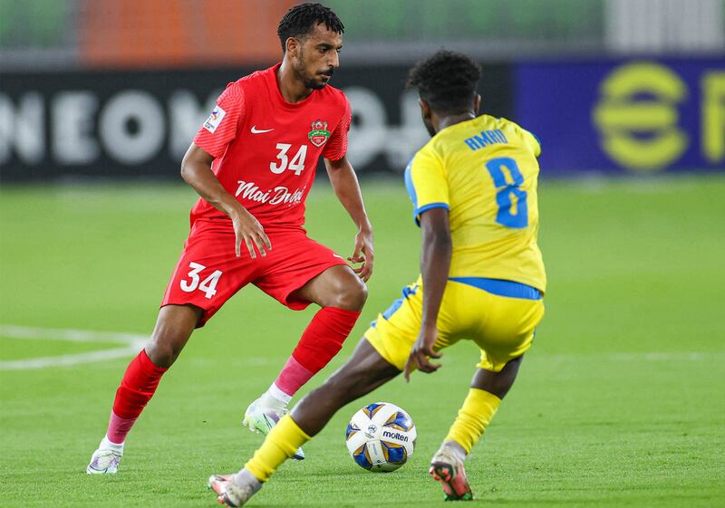 Shabab Al Ahli forward Hareb Abdullah on the ball against Gharafa midfielder Amro Surag. AFP