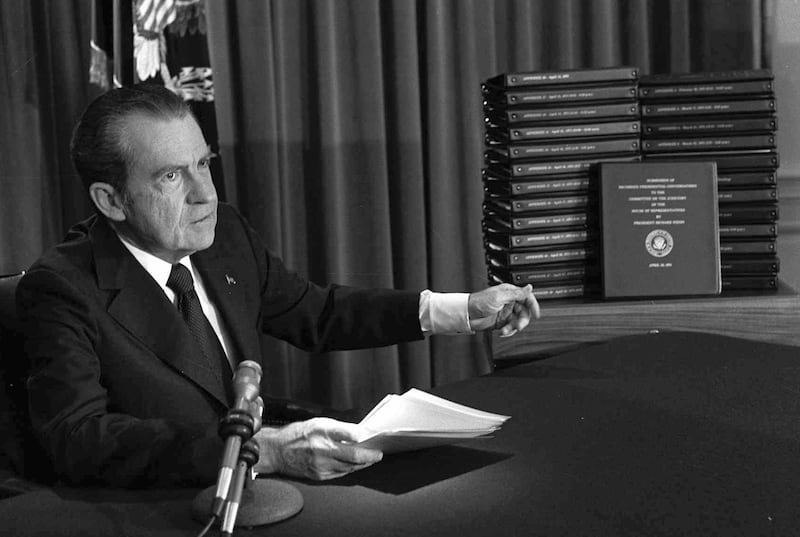 Former US president Richard Nixon points to transcripts of tapes after he announced during a televised speech that he would turn them over to House of Representatives impeachment investigators during the Watergate scandal. AP 