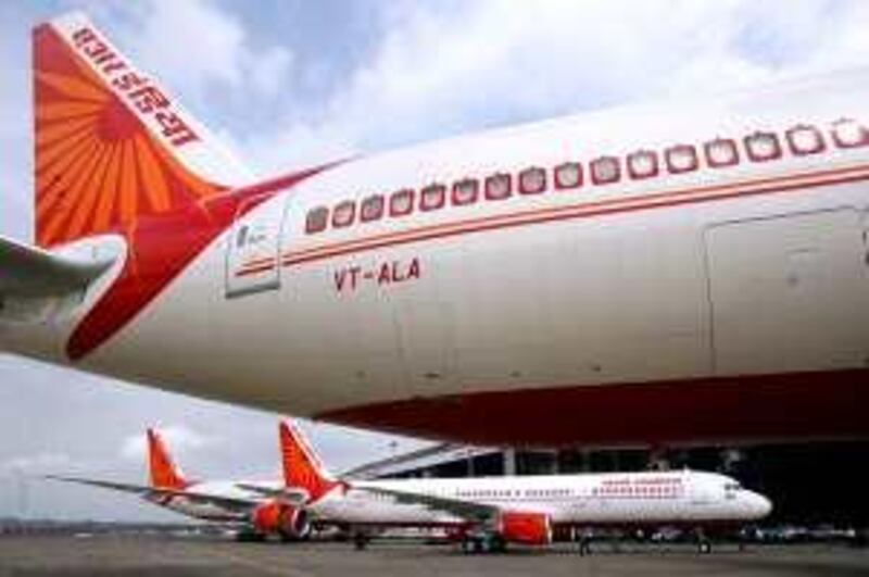 Air India's newly acquired Airbus A321 and Boeing 777-200 LR aircrafts are on display at the tarmac of Mumbai airport July 30, 2007. State-run Air India may need another 60 new aircraft by 2011 to expand operations and meet growing demand, the firm's chairman said on Saturday. REUTERS/Punit Paranjpe (INDIA)