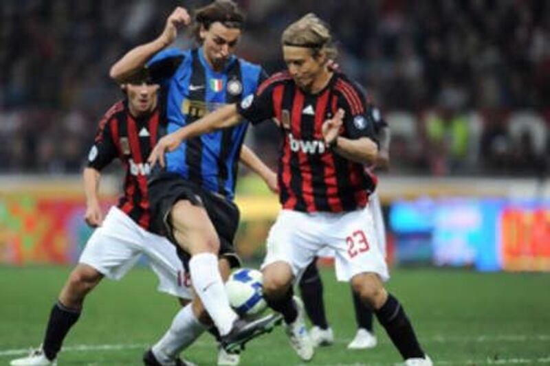Inter's Zlatan Ibrahimovic, left, struggled in the Milan derby to link up with the wide players coach Jose Mourinho likes to play off of him.