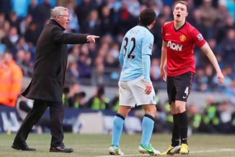 Phil Jones, right, has mostly been deployed as a holding midfielder in Manchester United's biggest matches this season, and will likely be used there again tonight. Tom Purslow / Getty Images