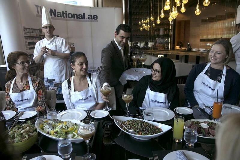 Guests and The National staff enjoy the food and the company after a morning spent cooking at the #healthyliving cooking experience. Silvia Razgova / The National