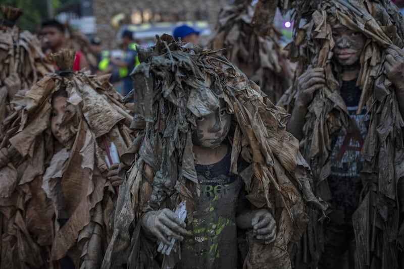 Devotees covered in mud and dried banana leaves take part in the Taong Putik ("mud people") Festival  in the village of Bibiclat in Aliaga town, Nueva Ecija province, Philippines. Each year, the residents of Bibiclat village in Aliaga town celebrate the Feast of Saint John by covering themselves in mud, dried banana leaves, vines, and twigs as part of a little-known Catholic festival. Getty Images