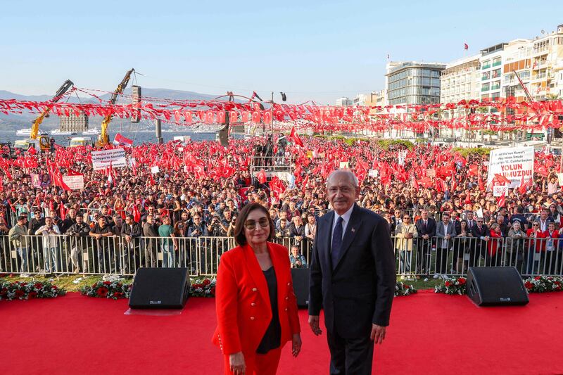 Mr and Mrs Kilicdaroglu pose in front of thousands of his supporters. Republican People's Party Press Service / AFP