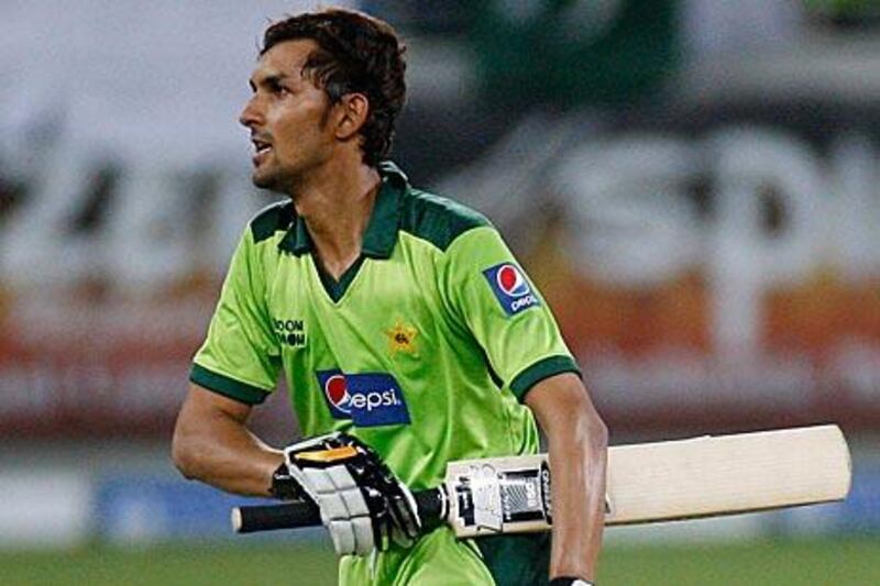 The Pakistani cricketer Zulqarnain Haider celebrates after scoring the winning runs in a match against South Africa at the Dubai Cricket Stadium on Friday. Match-fixers are believed to have demanded a South African win and Zulqarnain has fled the team camp after receiving death threats.