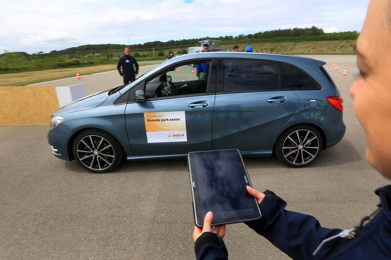 A BMW car is parked via remote control using a mobile device at a Bosch demonstration of driverless technology in Boxberg, Germany. Krisztian Bocsi / Bloomberg