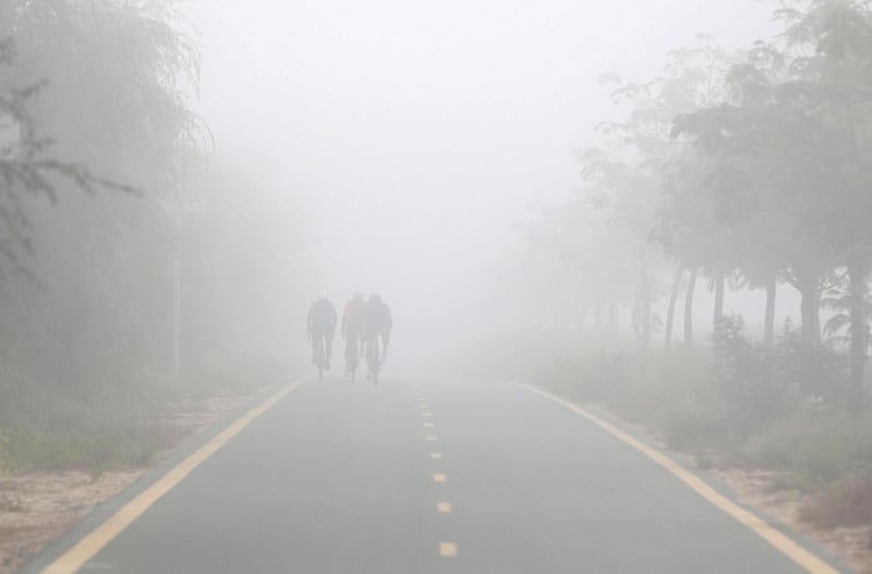 Dubai, United Arab Emirates - Reporter: N/A. News. Weather. Cyclists on Al Qudra cycle track during heavy fog in Dubai. Thursday, February 11th, 2021. Dubai. Chris Whiteoak / The National