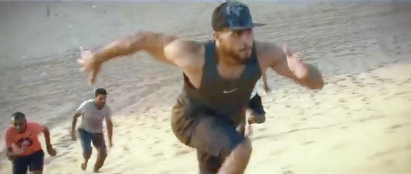 Screenshot from a video posted on Dubai Police's Facebook page of Dubai Police's intense morning exercises, which included running on sand dunes in Al Khawaneej, in the presence and participation of 1st Lieutenant Engineer Khalifa Al Roum, Secretary General of Dubai Police Youth Council for #dubaifitnesschallenge