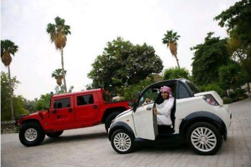 Yousif Bin Saeed al Lootah has a MyCar and a Reva; his little MyCar is a big contrast to the normal road-going vehicles of the UAE, such as a Hummer. Amy Leang / The National