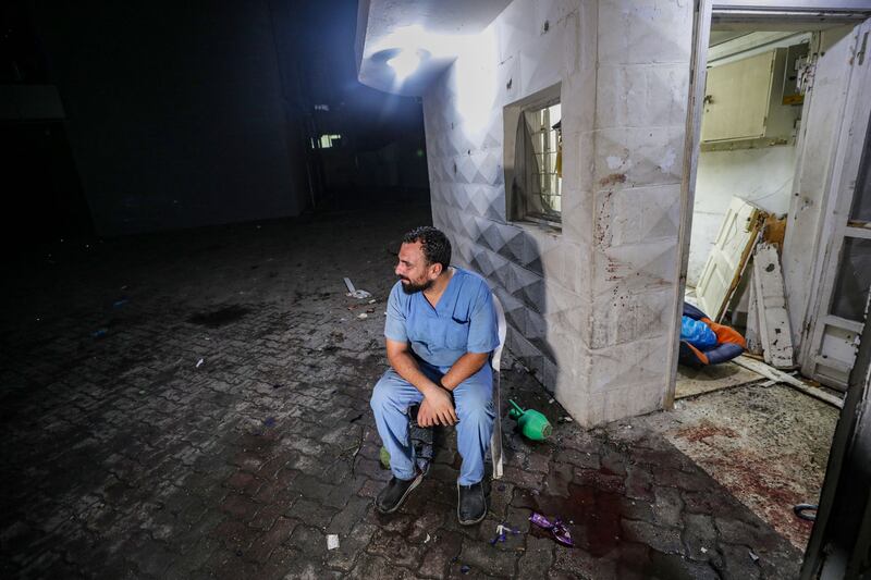 A doctor at Al Ahli Hospital after an air strike in Gaza city. EPA