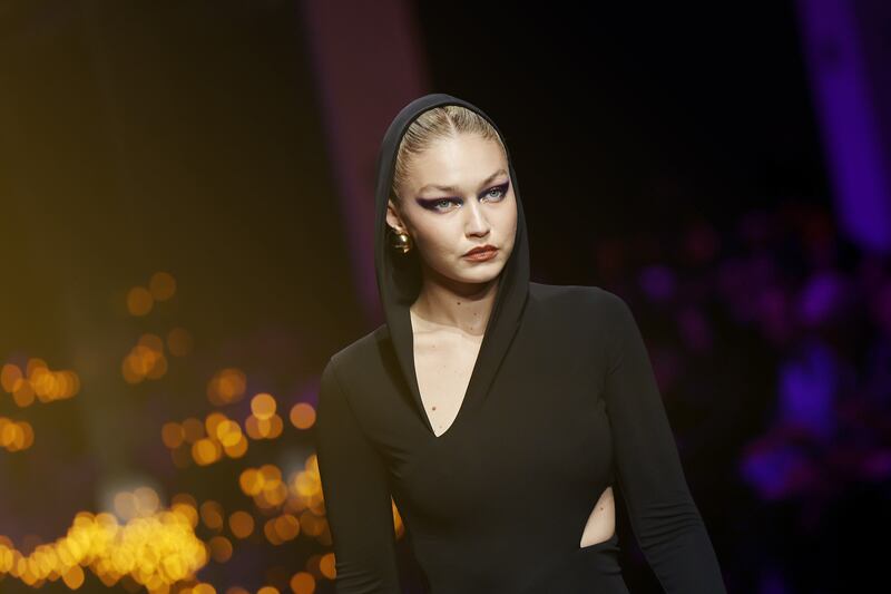 Gigi Hadid in black at the start of the show. Getty