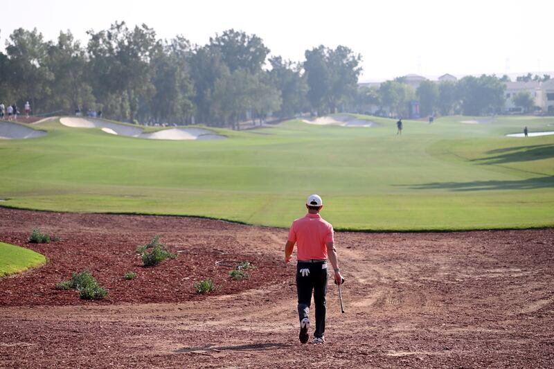 Rory McIlroy walking down 14th hole. Getty
