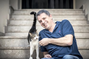 Animal rescue volunteer and former UAE resident Andreas Rosener with a rehomed cat. Courtesy Andreas Rosener
