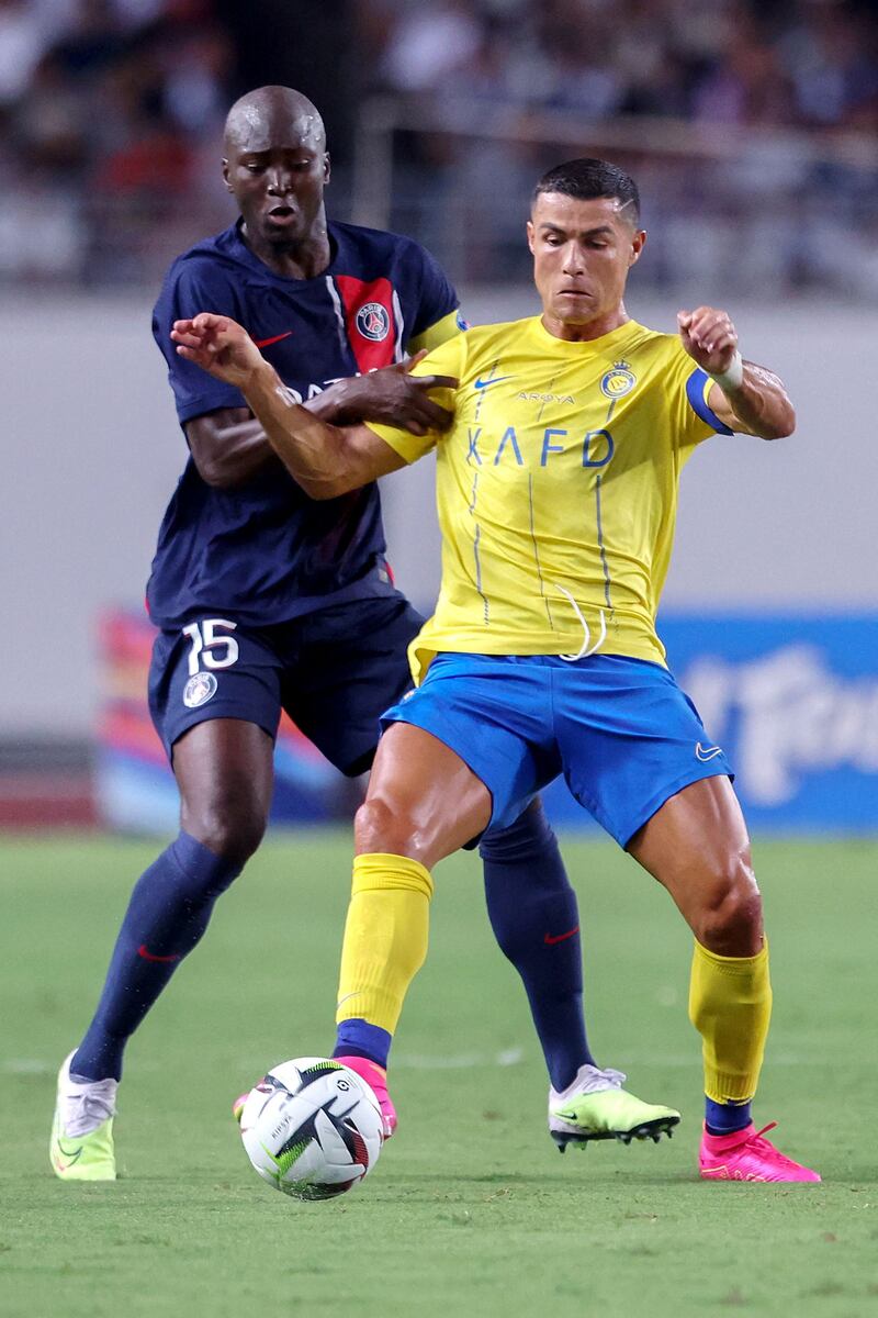 PSG's Danilo Pereira battles for the ball with Al Nassr's Cristiano Ronaldo. AFP