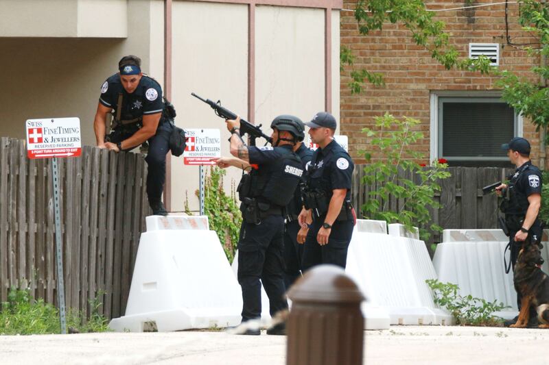 Officers search the area surrounding the park. AFP